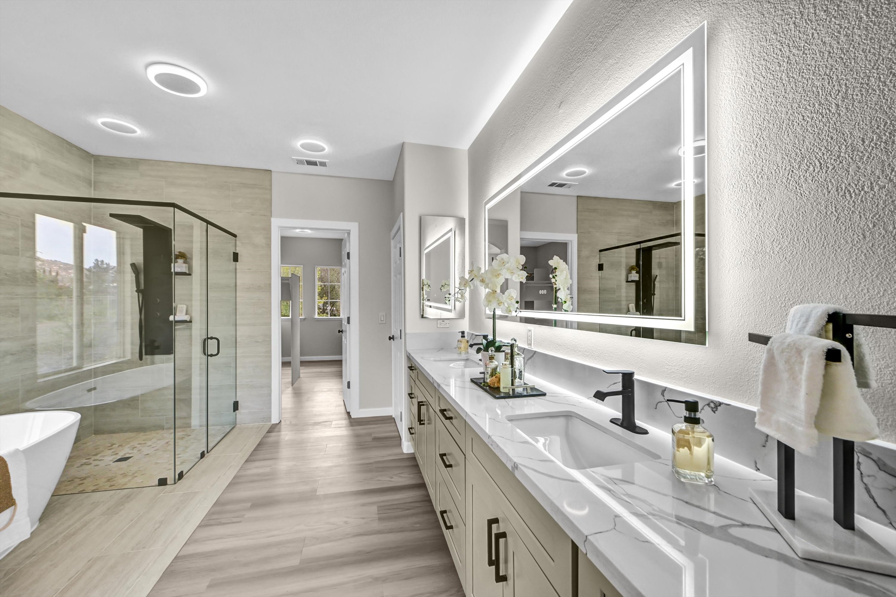 Modern ADU bathroom with dual vanity and luxury tile